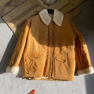 Brown shearling jacket with light color collar and cuffs never worn